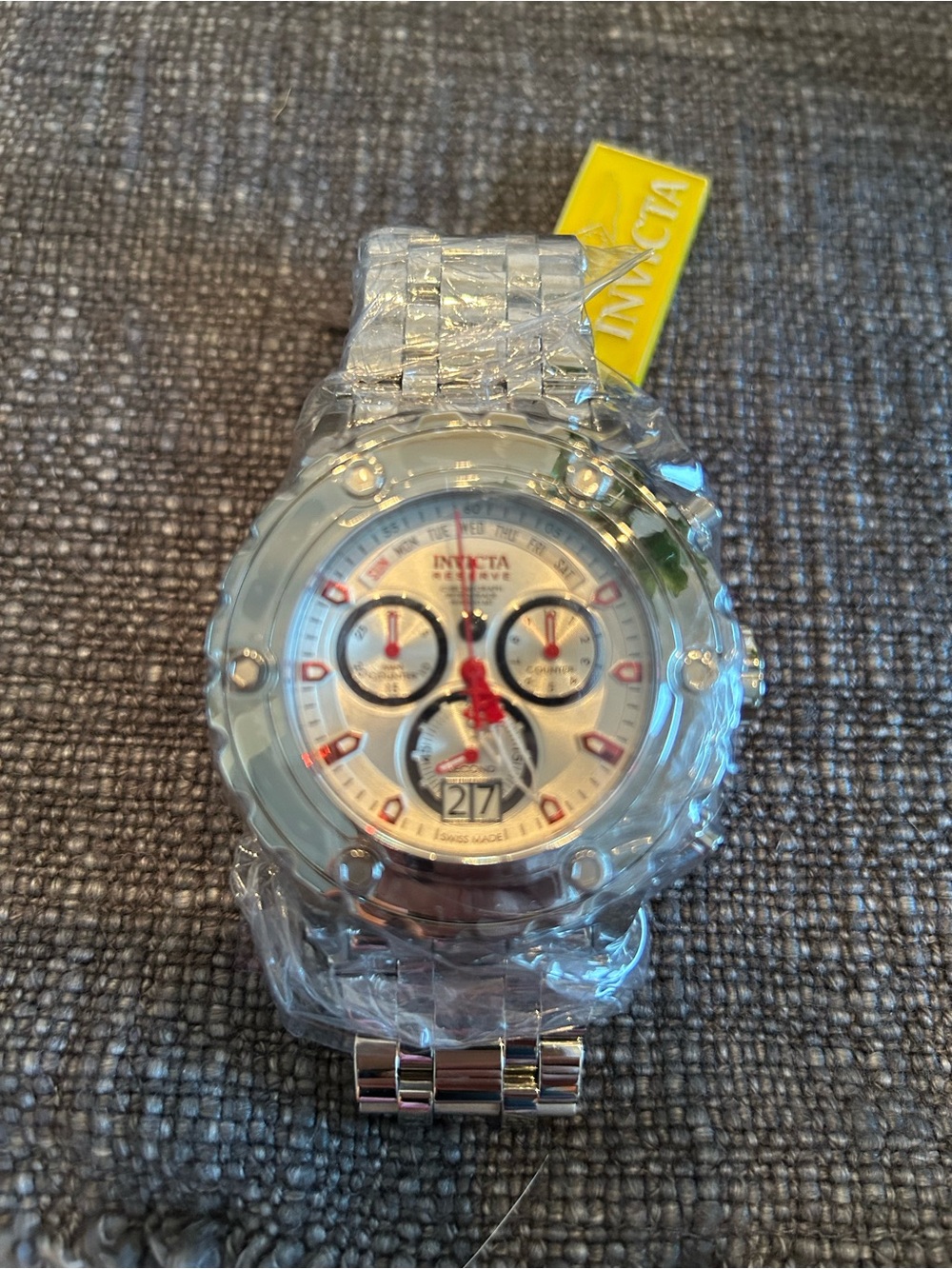 Invicta Silver Chronograph Watch with Red Accents